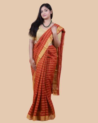 Gracefully timeless, this Chanderi silk saree features a classic check (chowkadi) weave enhanced with fine gold zari lines that lend subtle shimmer and structure