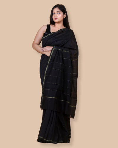 A classic Dark Green Chanderi silk saree highlighted with delicate zari lines. Designed for understated festive and formal moments A classic Dark Green Chanderi silk saree highlighted with delicate zari lines. Designed for understated festive and formal moments