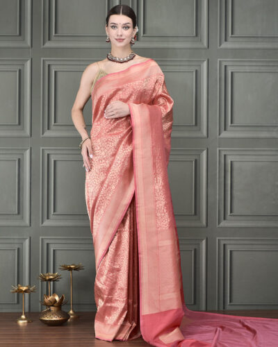 Crafted in soothing peach Banarasi silk, this handloom saree features the timeless Tanchoi weave, delicately detailed with elegant Kashmiri motifs throughout
