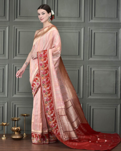 Experience the ethereal glow of hand-woven Banarasi Tissue Silk, where timeless heritage meets a breathtaking, metallic luster