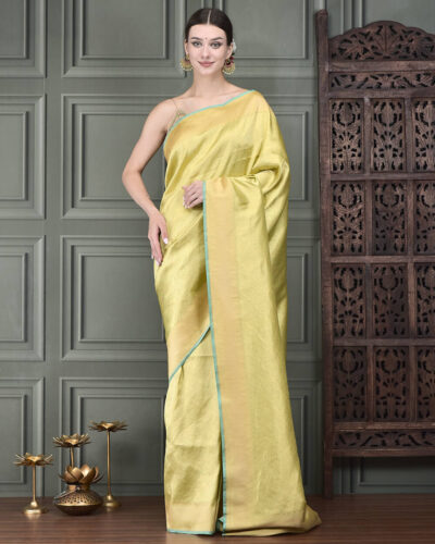 A graceful Banarasi handloom silk saree in soothing pista green, intricately woven in Tanchoi technique with elegant Kashmiri motifs all over