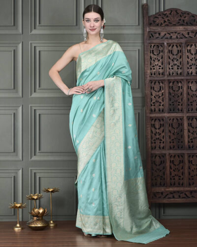 A handloom Katan Banarasi saree in graceful bail booti, framed by rich gold zari borders — heritage beauty, effortlessly regal